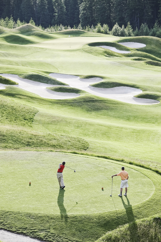 view-from-above-of-two-golfer-teeing-off-on-a-golf-2022-03-04-02-14-26-utc.jpg
