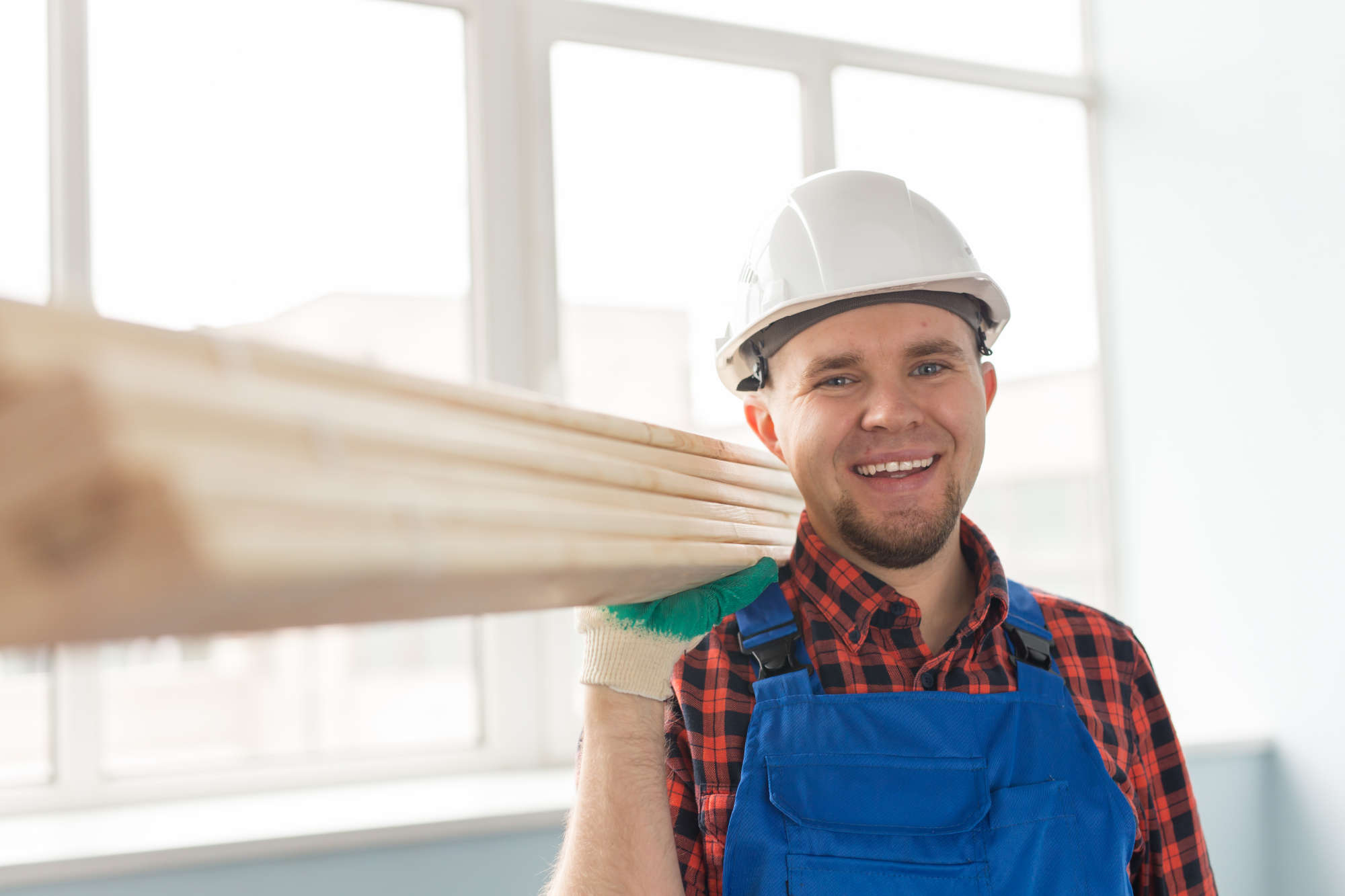 portrait-of-handsome-male-builder-laughing-infront-Q8N7DXV.jpg